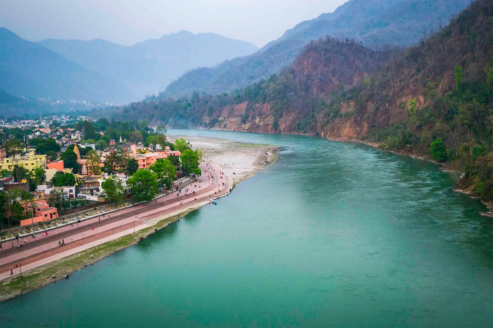 Rishikesh is a city in the Indian state of Uttarakhand, located on the banks of the Ganges River at the foothills of the Himalayas. It is internationally known as a center for yoga, meditation, and Hindu pilgrimage, and is often called the “Yoga Capital of the World.” The city also serves as a gateway to the Garhwal Himalayas and several major pilgrimage routes.